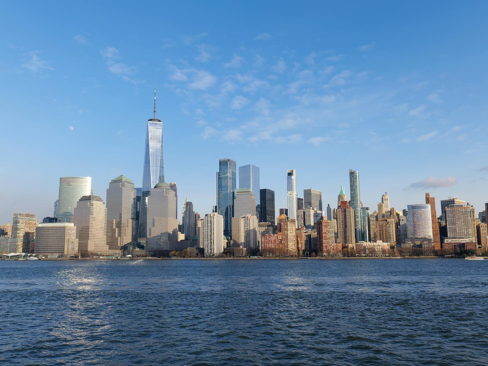 Lower Manhattan skyline across New York Harbor on a clear day